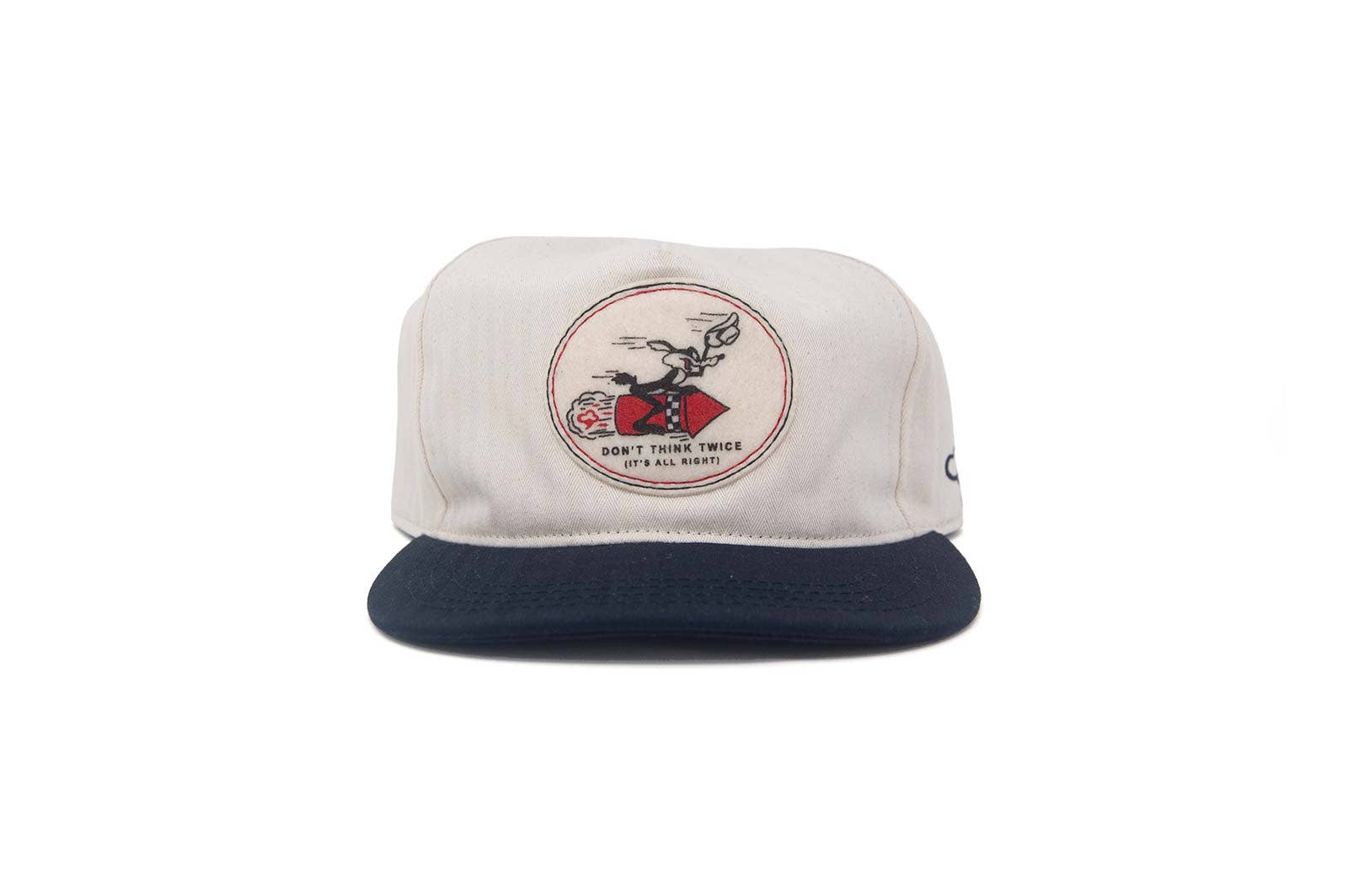 The Ampal Creative - Don't Think Twice Snapback in navy features a classic front patch with a cartoon motorcyclist and the text "DON'T THINK TWICE IT'S ALL RIGHT.