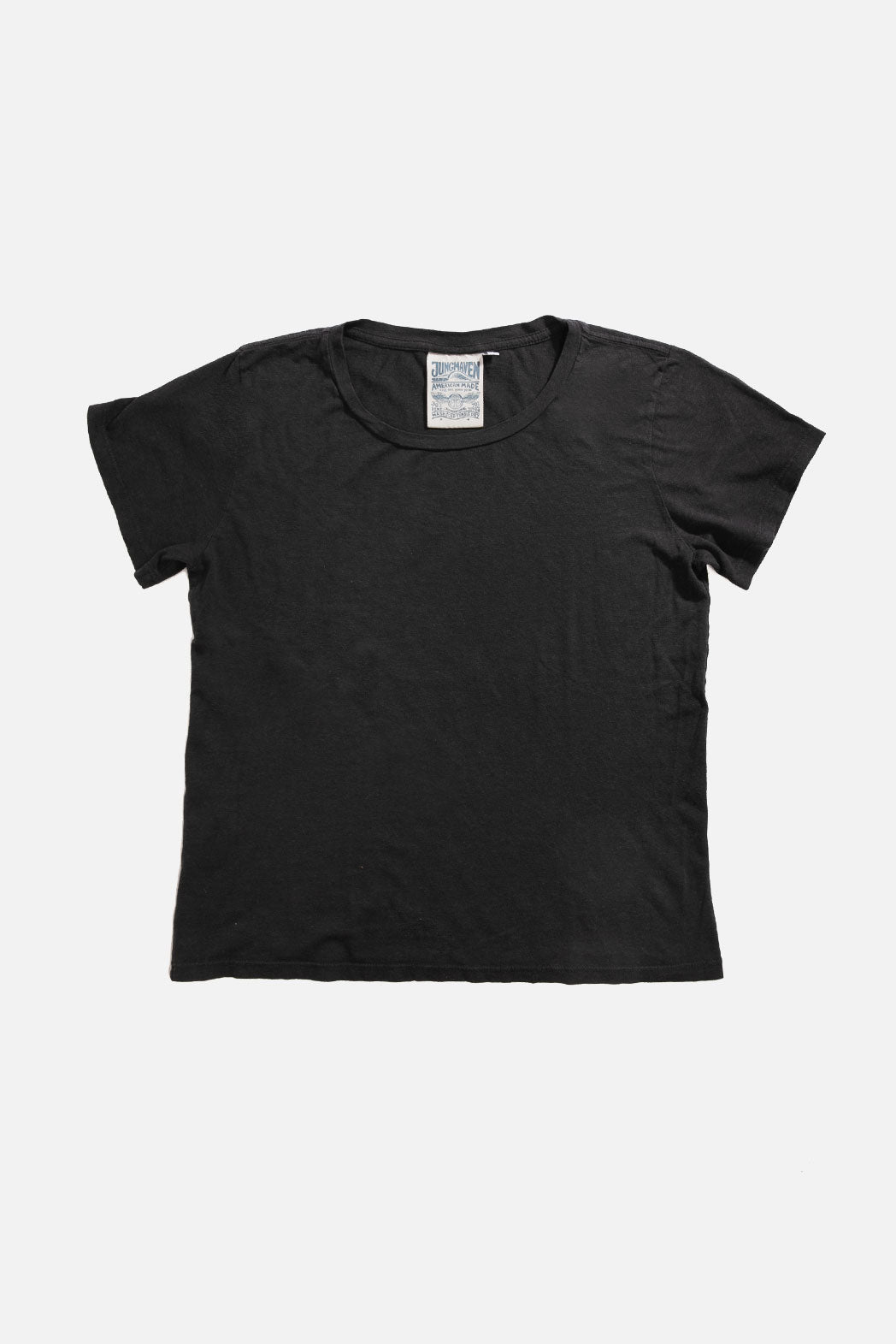 The Jungmaven Ojai Tee in black, a unisex hemp blend crewneck t-shirt by Jungmaven, is laid flat on a white background with its neck tag visible at the collar.