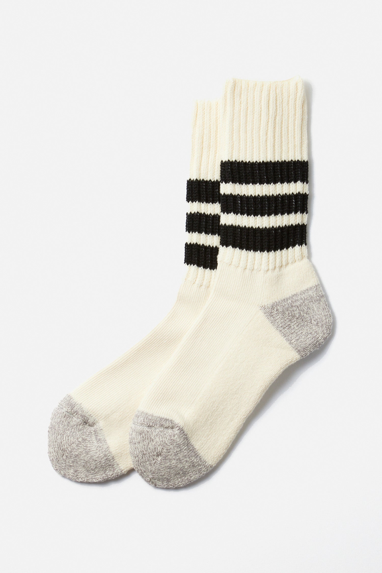 The RoToTo Coarse Ribbed Old School Socks in Black by RoToTo feature cream-colored cotton with gray toes and heels, plus two black stripes near the top. The socks are displayed flat on a white background.