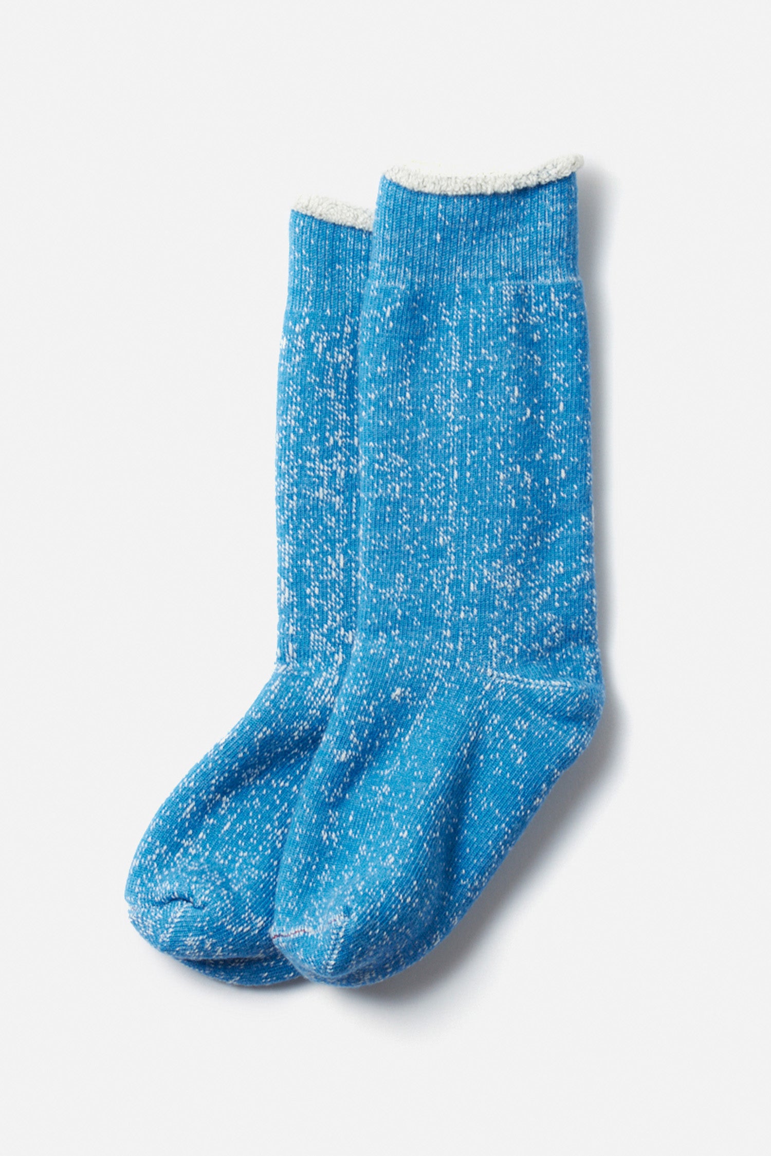 A pair of RoToTo Double Face Crew Socks in blue, featuring a cozy merino wool blend and white fluffy lining at the top, laid side by side on a plain white background.