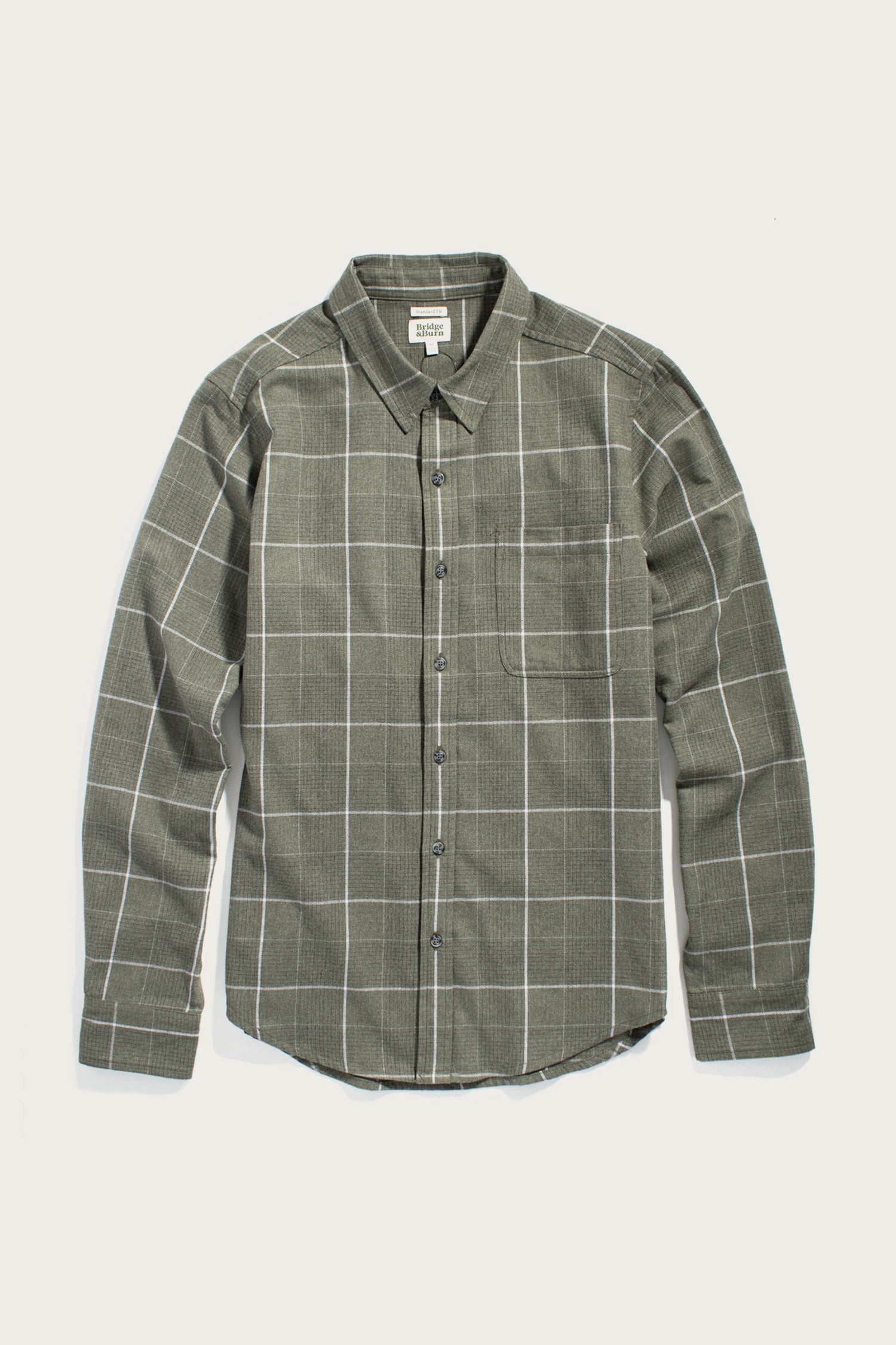 The Bridge & Burn Larson Shirt in Rosemary Twill Windowpane is a classic fit, long-sleeve button-up with a chest pocket and pointed collar, shown laid flat on a white background.