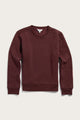 The Bailey Crew Sweatshirt by Bridge & Burn is a sustainable burgundy crewneck with long sleeves, ribbed cuffs, and a ribbed hem, shown laid flat on a light background.