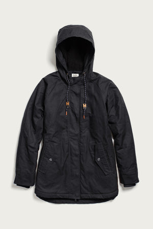 The Bridge & Burn Sequoia Parka in black waxed canvas features a hood with drawstrings, zip and button closure, two front flap pockets, ribbed cuffs, and soft fleece lining, shown laid flat against a light background.
