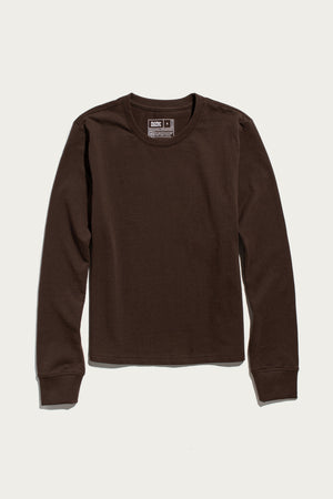 A Bridge & Burn Audrey Long Sleeve Tee in Truffle, featuring a relaxed fit and long sleeves, is laid flat on a white background. Made from recycled cotton, this crew neck shirt blends comfort and sustainability in an enduringly classic design.