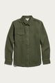 The Bird Shirt / Pine Flannel by Bridge & Burn features an olive green hue in a relaxed fit, crafted from organic cotton flannel. This long-sleeve shirt includes a collared neckline and a single chest pocket on the left side, and is showcased against a plain white background.