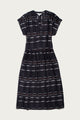 The Ira Dress by Bridge & Burn features short sleeves, a knee-length pullover design in Nightfall Stripe, with a V-neck, subtle waist pleats, and a relaxed fit.