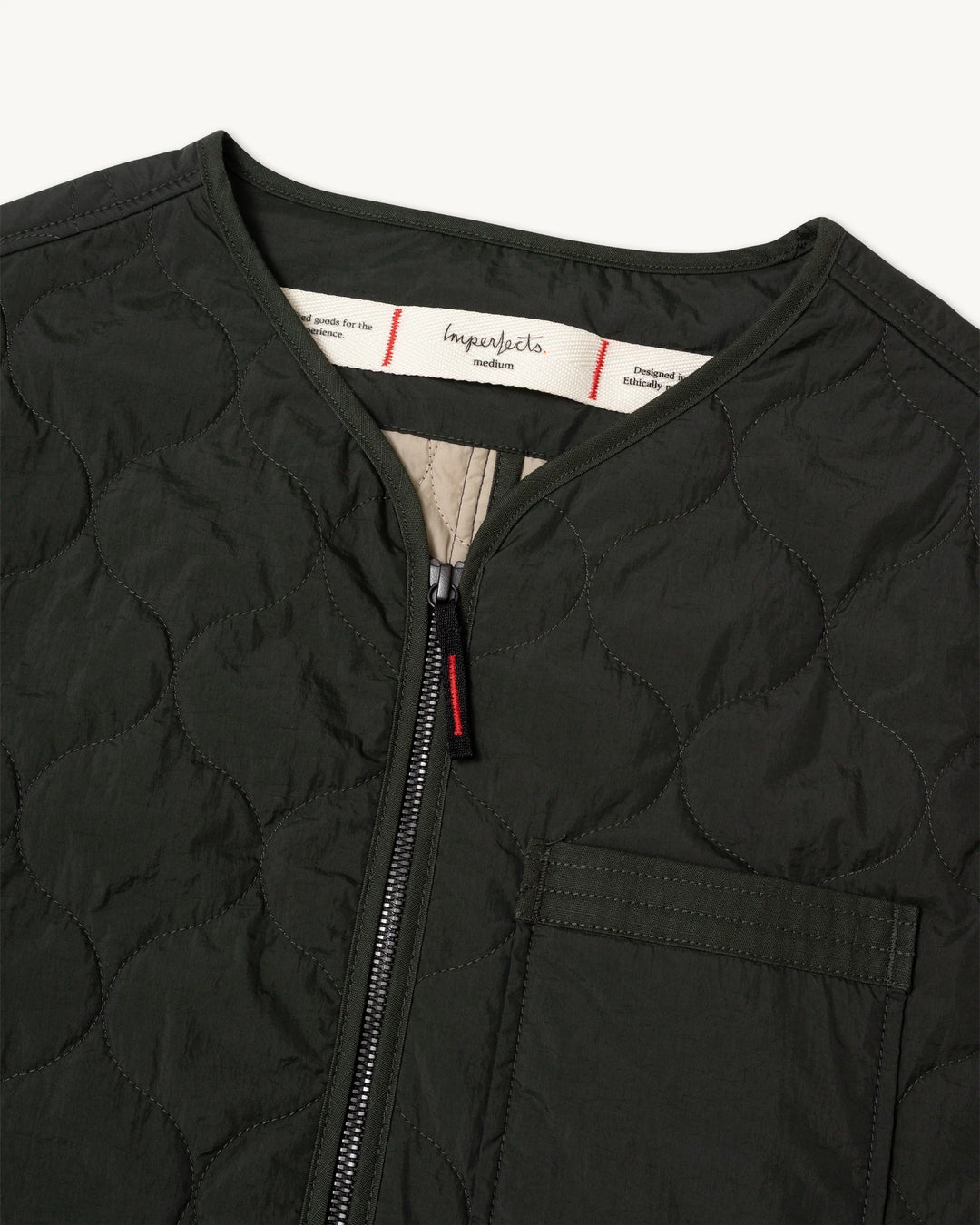 Dark olive green Imperfects - Shokunin Vest in Quilted Nylon / Greenroom, featuring a zip-front closure, chest pocket, and lightweight insulated jacket construction.