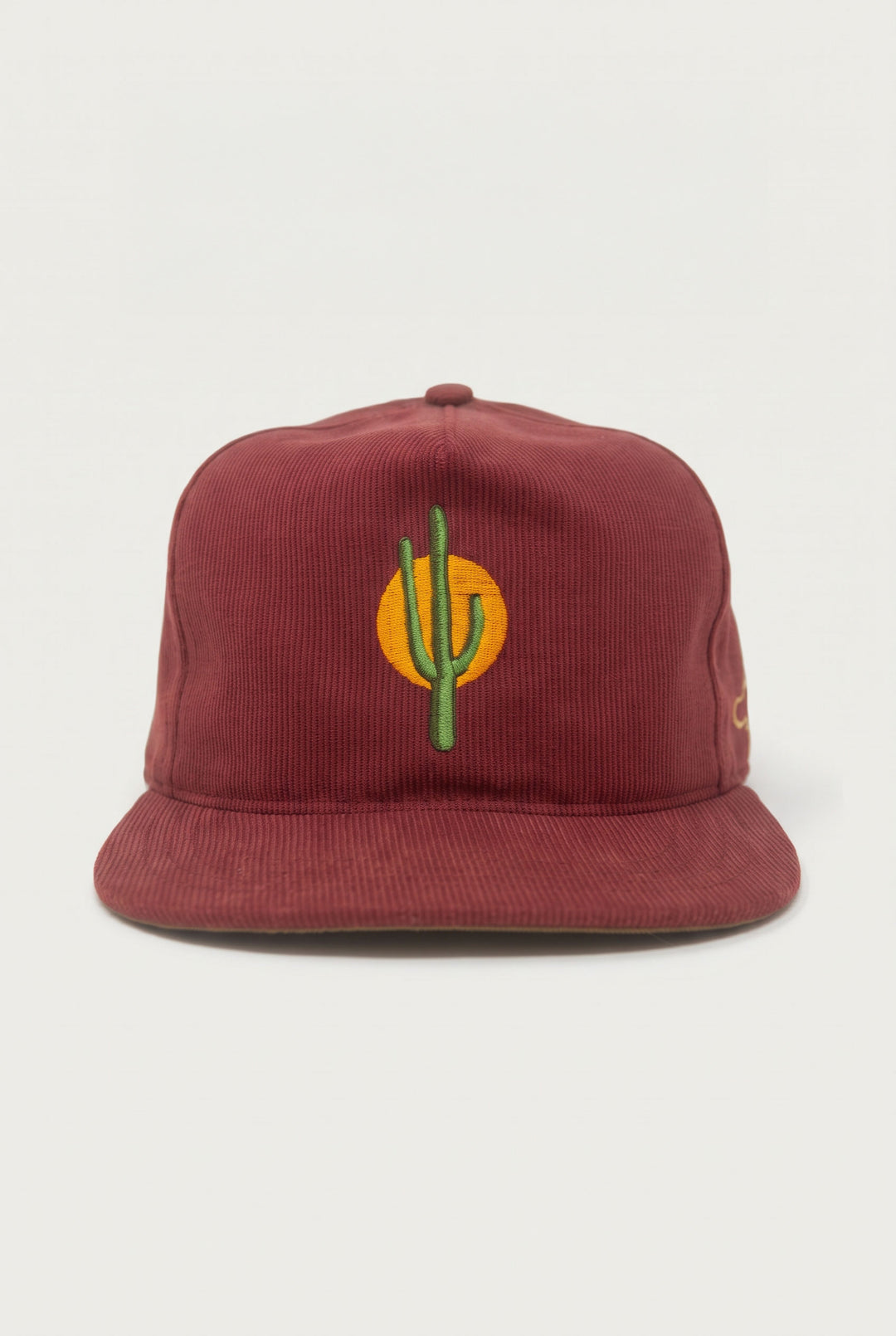 The Ampal Creative - Sunset Cactus / Brick maroon Bedford cloth baseball cap featuring an embroidered green cactus in front of a yellow sun.