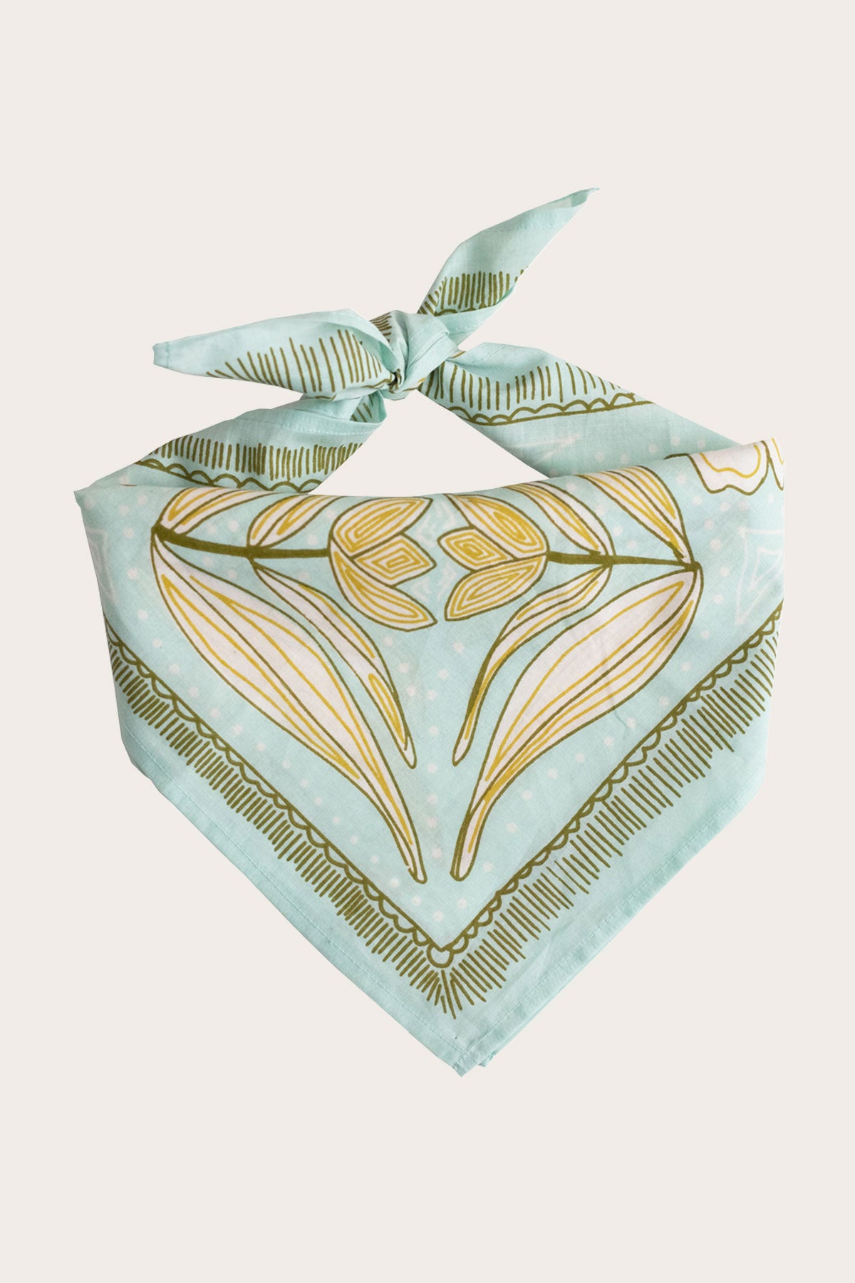 The Handker Bandanas - No. 012 Eliza Bandana from Handker Bandanas is a light blue premium cotton bandana with yellow and olive green abstract patterns, tied in a knot with decorative, symmetrical fine lines and shapes.