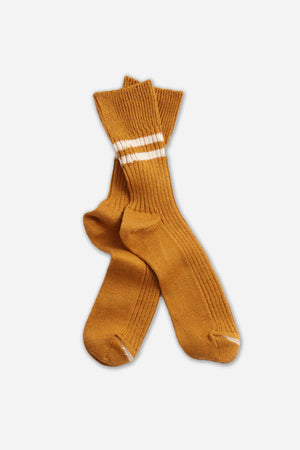 RoToTo’s Hemp Organic Cotton Stripe Socks in Sunset Gold feature a ribbed mustard yellow design with two white stripes near the cuffs, shown on a plain white background.