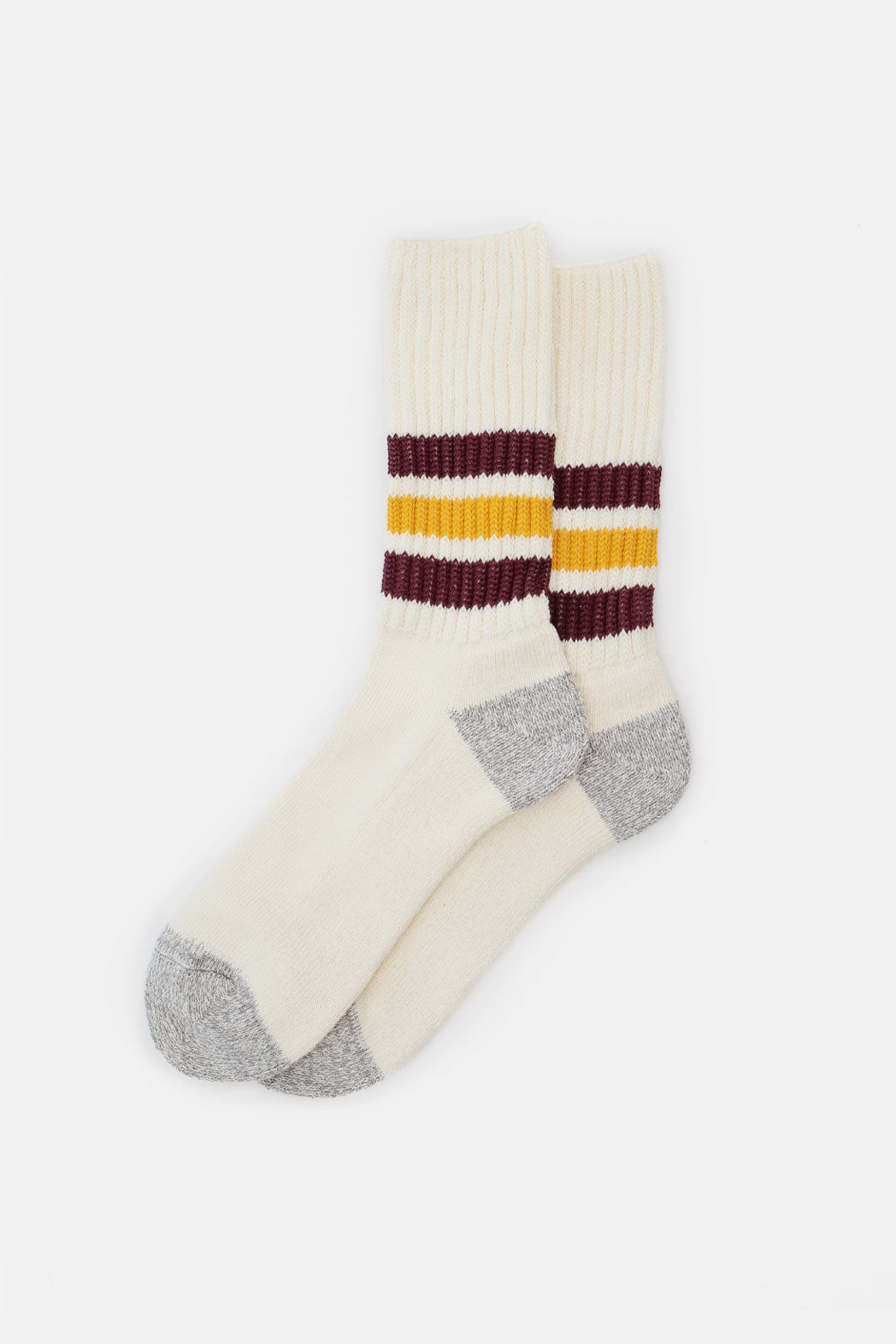 A pair of RoToTo Coarse Ribbed Old School Socks in Bordeaux Yellow, featuring cream color, gray heels and toes, cushioned soles, and two maroon plus one yellow stripes around the calf, laid flat on a white background.